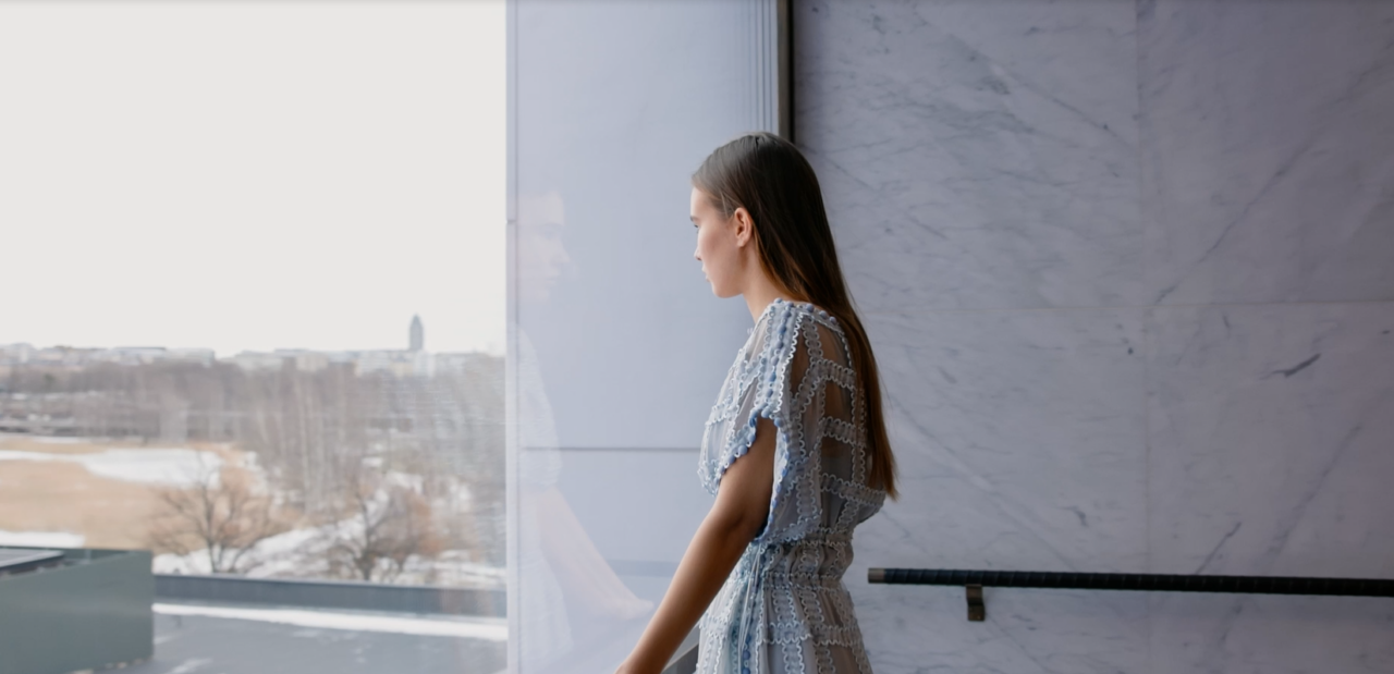 A young woman looking out of the window.