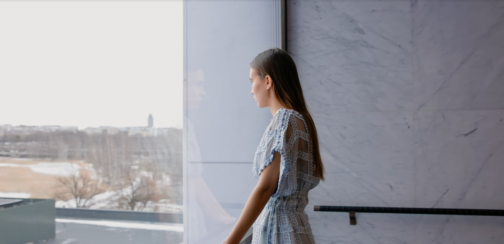 A young woman looking out of the window.